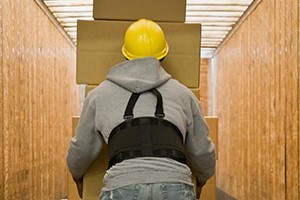 Image of a guy lifting boxes